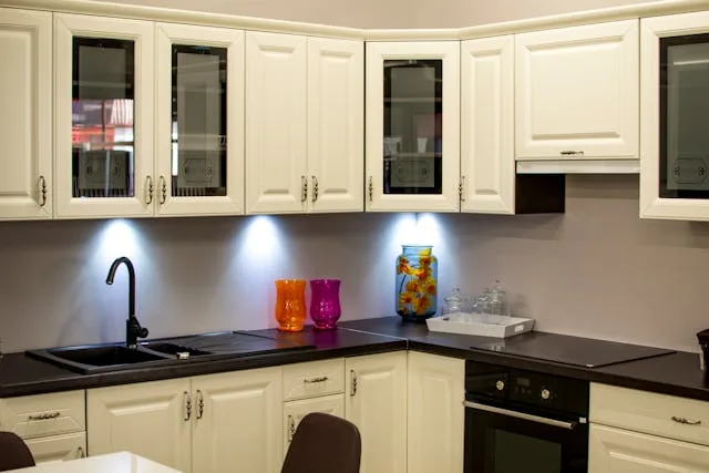 olivenhain A Kitchen with black coountertops and white cupboards